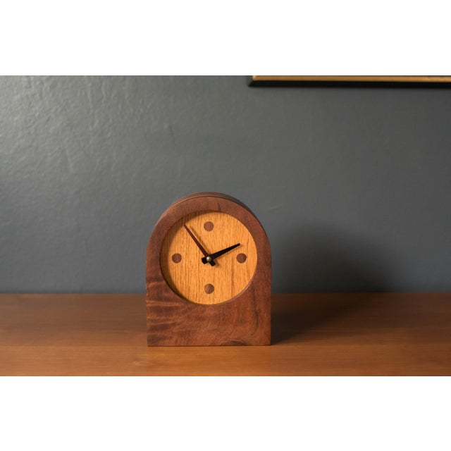 Mid century modern studio craft clock made of solid walnut and oak circa 1960's. This piece displays unique craftsmanship...