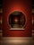 A large round mirror with a soft cream-colored frame and a clean sculptural base. The rounded silhouette and neutral...