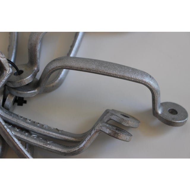A set of 10 industrial cast aluminum cabinet/drawer pulls.