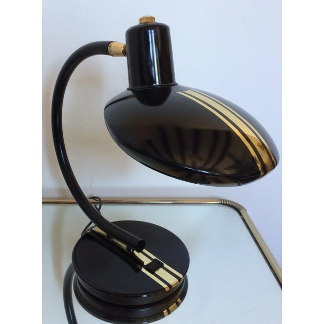 This vintage table lamp features a swiveling head. European Plug (up to 250V).The wiring of this item may be original and...