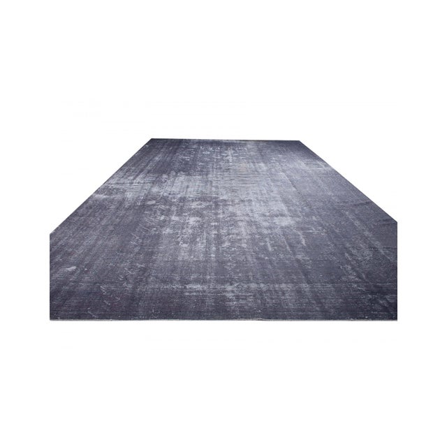 Handknotted vintage wool rug from Oushak region of Turkey. Approximately 65-75 years old. In very good condition.