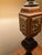 This table lamp features a traditional, multi-sectioned base with an eclectic mix of finishes and textures.Key Design...