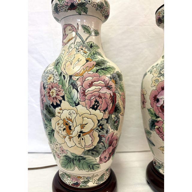 A pretty pair of ceramic table lamps from the 1980's-90's. The ceramic vases are painted in a Shabby Chic floral style...