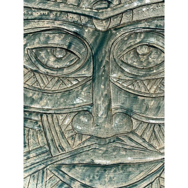 A powerful and sculptural Raku-fired clay mask bowl by Gene Pearson (1946–2018), one of Jamaica’s most influential and...