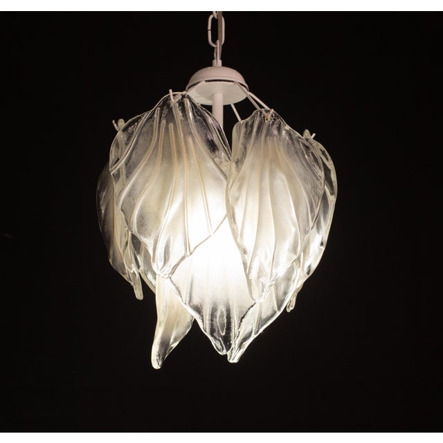 Stunning chandelier with transparent and opaque leaves from Murano, 1970. The chandelier consists of 9 beautiful...