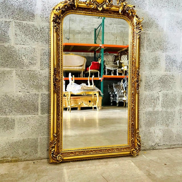 This French style gold floor mirror is an elegant statement piece that highlights exceptional craftsmanship and classic...