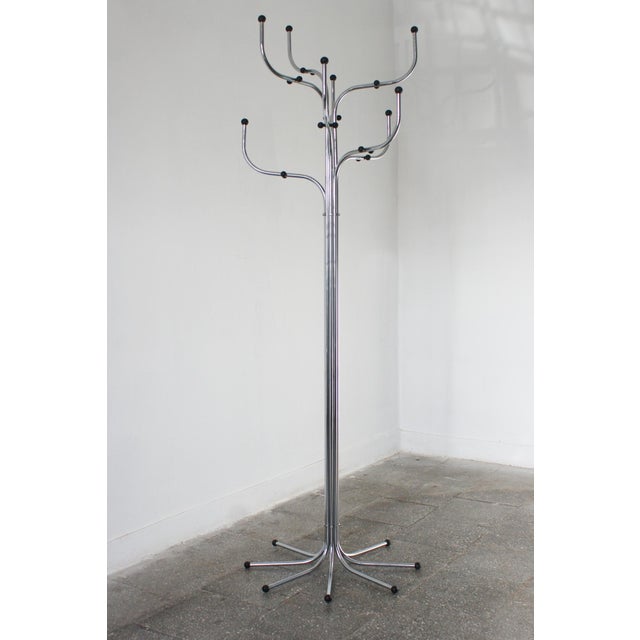 Coat Tree hanger consisting of eight arms of bent steel ending in synthetic balls. The design dates back to 1971. Coat...