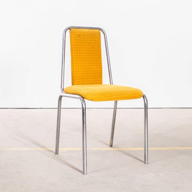 1980’s Mustard Yellow Upholstered Chrome Framed Stacking Dining Chairs – Set Of Fourteen. Produced in the late eighties by...