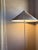 Characterized by its elegant and airy lampshade and rattan-covered stem, the 9602 Floor Lamp shows the designer's...