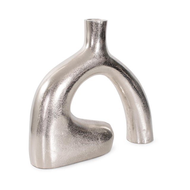 An unexpected sharp turn at the base gives this design its name The Reverse Vase. Crafted in cast Aluminum this creation...