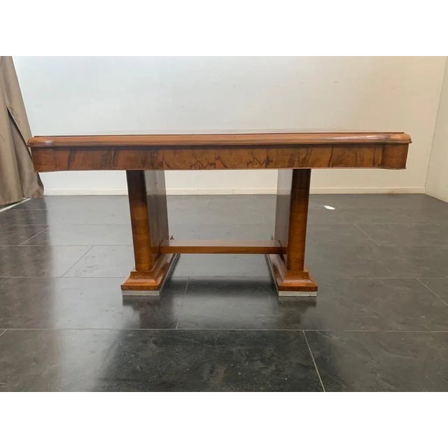 Art Deco table in walnut and walnut feather with shaped top, steel base. Solid and functional, insignificant signs of wear.