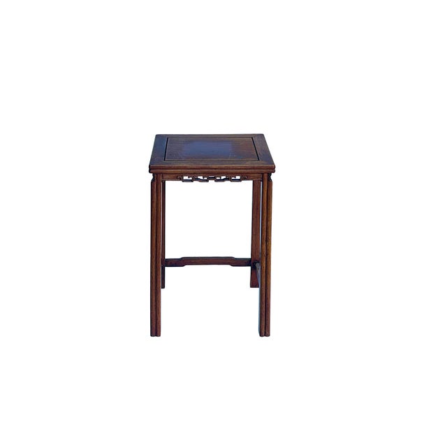 This elegant vintage Chinese side table or plant stand features classic mortise-and-tenon joinery and rich hardwood tones....