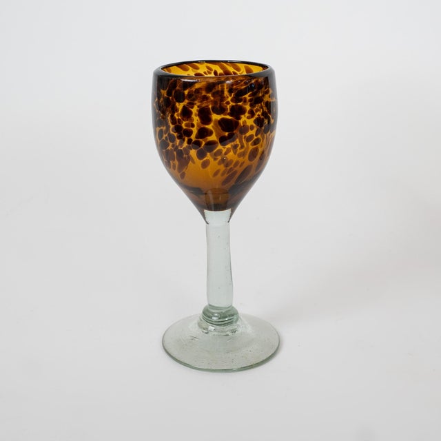 A striking set of six mid-century Italian handblown glass goblets attributed to Empoli, Italy, circa 1950. Each goblet...
