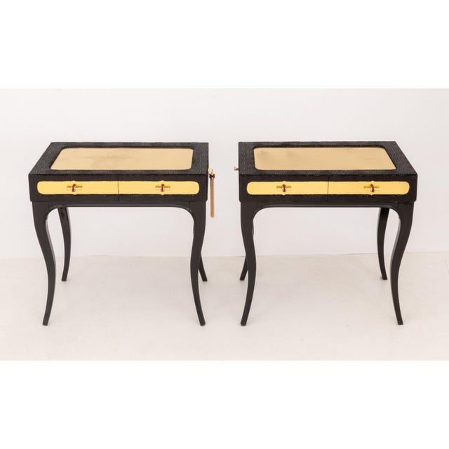 Pair of Koket "Exotica" Nightstands, each with gold-tone metal top above black snakeskin motif fabric covered drawers...