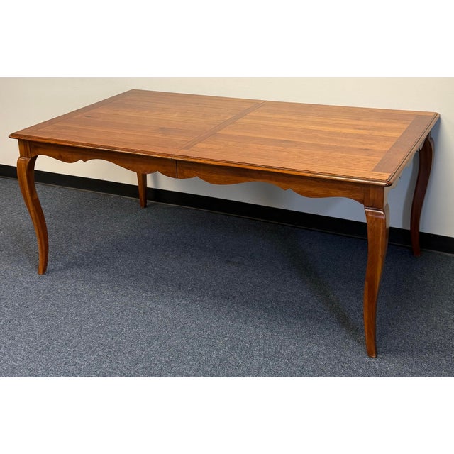 Bring French-inspired elegance to your dining room with this Ethan Allen Maison table. The expansive rectangular top...