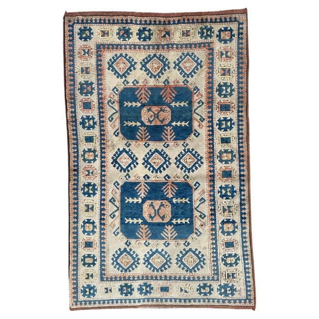 "Gorgeous Turkish Anatolian Rug: A true masterpiece from the mid-century era. This hand-knotted beauty boasts a...