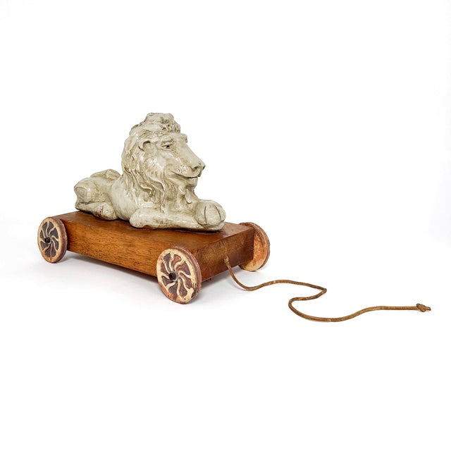 Charming studio pottery piece by artist Jon Carlos Lopez (American, b. 1940). Hand-modeled glazed stoneware lion mounted...