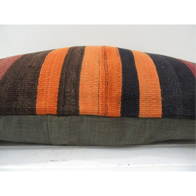 This is a pillow cover made from a vintage kilim rug. The piece was properly washed and ready to use. Pillow inserts not...