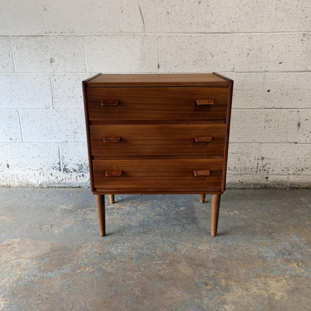 A Danish modern three-drawer chest designed by Poul Volther, dating to the 1960s. The piece has a simple, well-...