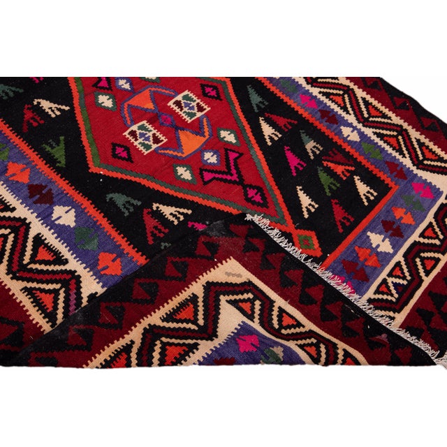Beautiful kilim handmade wool runner with a multicolor field. This Vintage flatweave rug features a gorgeous all-over...