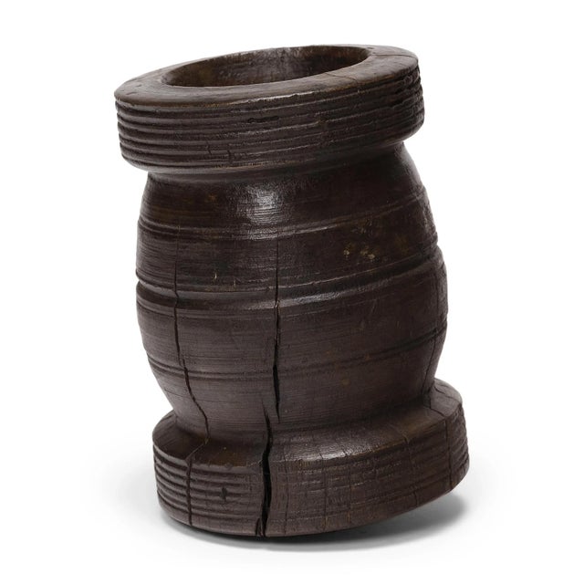 This petite pinewood vessel is an early 20th century mortar once used daily in a provincial kitchen to grind herbs,...