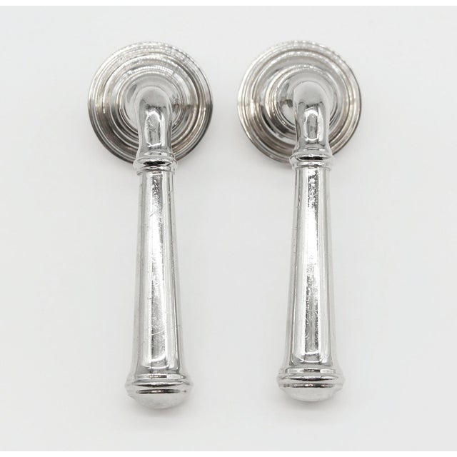 Fixed lever door knobs made of brass with a chrome finish. Both levers can be screwed to any door surface to be used as...