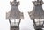 Spanish Revival lanterns, hammered conical form top with tapering glass shade resting on quadripartite legs. Each with a...