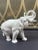 Vintage white porcelain elephant figurine stands 8.25” tall with trunk up. A fine neutral styling piece for a bookshelf or...