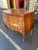 This striking 20th-century Italian bombé commode beautifully showcases the dramatic elegance of the Louis XV Rococo...