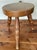 Vintage wood milking stool with three turned legs and a handle for carrying. Made in Japan. Top is 10” across. Height is...