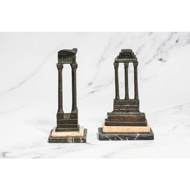 Step into the romantic spirit of the Grand Tour with this pair of 19th-century bronze architectural models, capturing two...