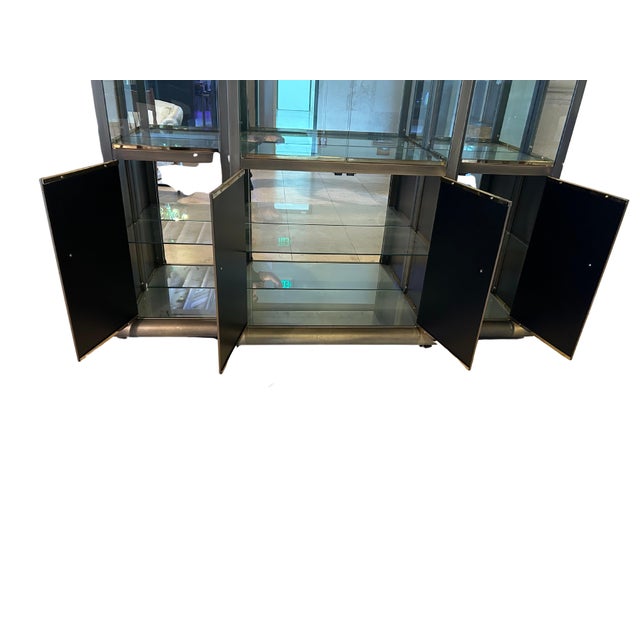 This striking 3-part display cabinet by Design Institute America showcases the brand’s signature blend of sleek modernism...