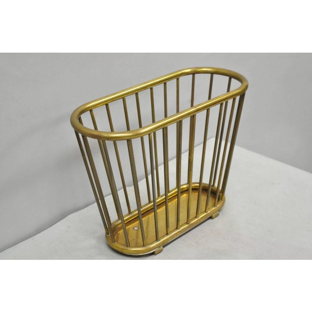 Vintage Gatco Mid Century Modern Solid Brass Spindle Modernist Magazine Rack, Hong Kong. Circa Mid 20th Century....