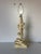 Hollywood Regency Chinoiserie style faux bamboo and lotus flower table lamp with lily pad base. This sculptural heavy...