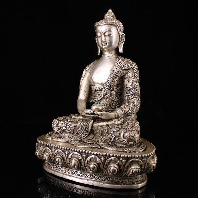 This is a finely crafted antique silver-gilt bronze sculpture of Amitayus Buddha, the Buddha of Infinite Life, a revered...