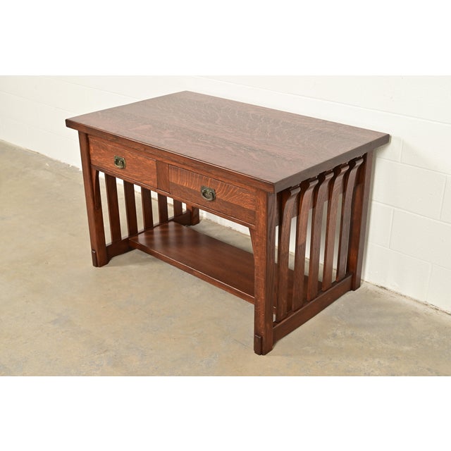 An exceptional antique Mission or Arts & Crafts writing desk or library table In the manner of Stickley Brothers By...