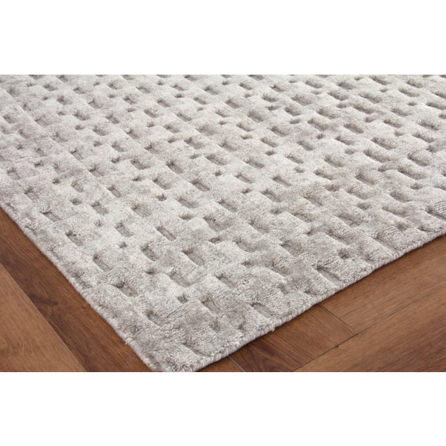 Ther versatility of a solid piece with a little more intrigue. A mix of high and low geometric shapes gives the Rothwell...