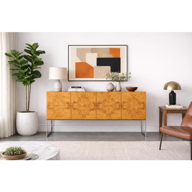 A masterpiece of mid-century modern design, this exceptional burl wood credenza was created by the legendary Milo Baughman...