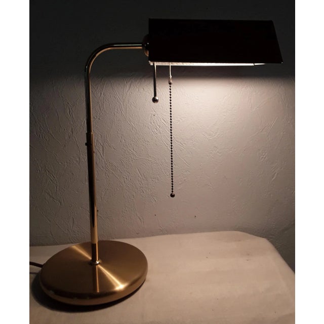 Vintage Brass Colored Swiveling Table Lamp, in Good conditions. Designed 1980 to 1989 This piece has an attribution mark,...