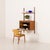 A home office one-bay teak wall unit with a drop-door cabinet, designed by poul cadovius for cado in the 1960s, provides...