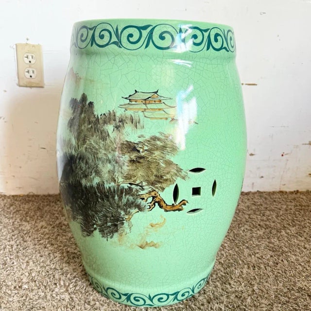 Experience the timeless elegance of traditional Chinese design with this exquisite Celadon Glazed Porcelain Garden Stool....