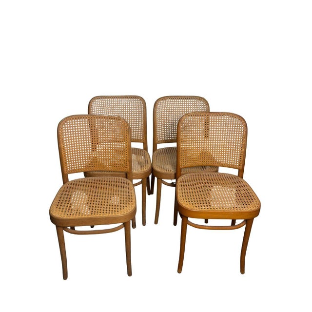 A beautiful set of four vintage Prague-style bentwood dining chairs, inspired by Josef Hoffmann's celebrated No. 811...
