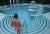 Caracalla Therme 1990 by Slim Aarons Slim Aarons Limited Estate Edition A woman experiences the Caracalla Therme spa in...
