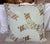 These pillows are crafted from hand-stenciled Nomi linen, featuring an intricate and symmetrical design in soft blue and...