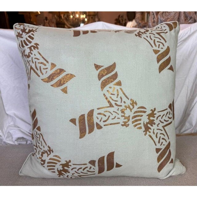 These pillows are crafted from hand-stenciled Nomi linen, featuring an intricate and symmetrical design in soft blue and...