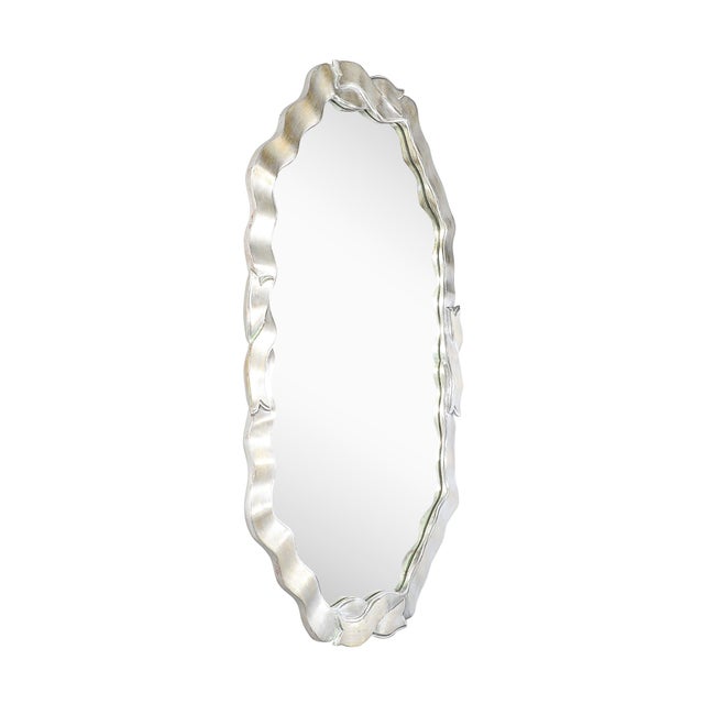 This Mid-Century Modernist white giltwood ribbon mirror, crafted in Italy circa 1950, is an exceptional example of...