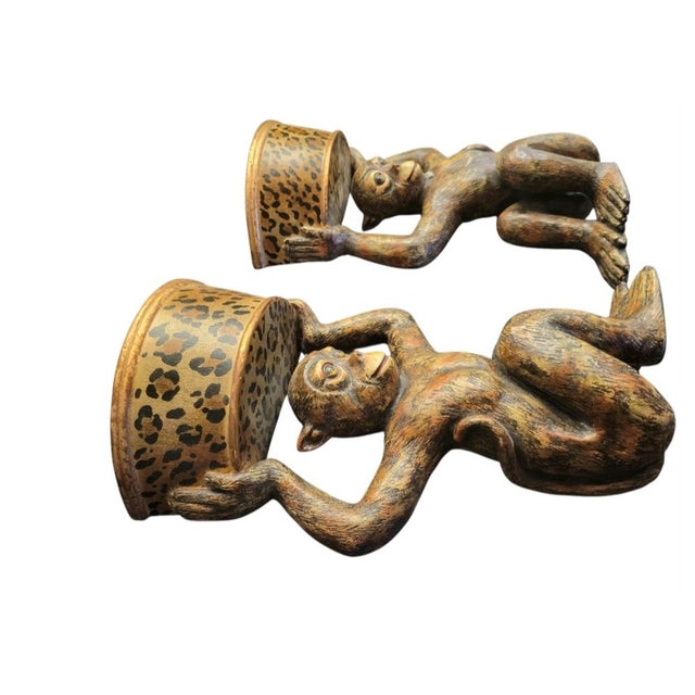 A wonderful unique pair of vintage monkey wall brackets. They are such a fun pair with leopard painted shelf and a cute...