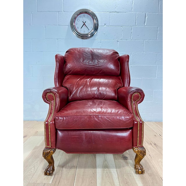 Add a touch of nobility to your space with this reclining Napoleon III style leather wingback fireplace armchair in the...