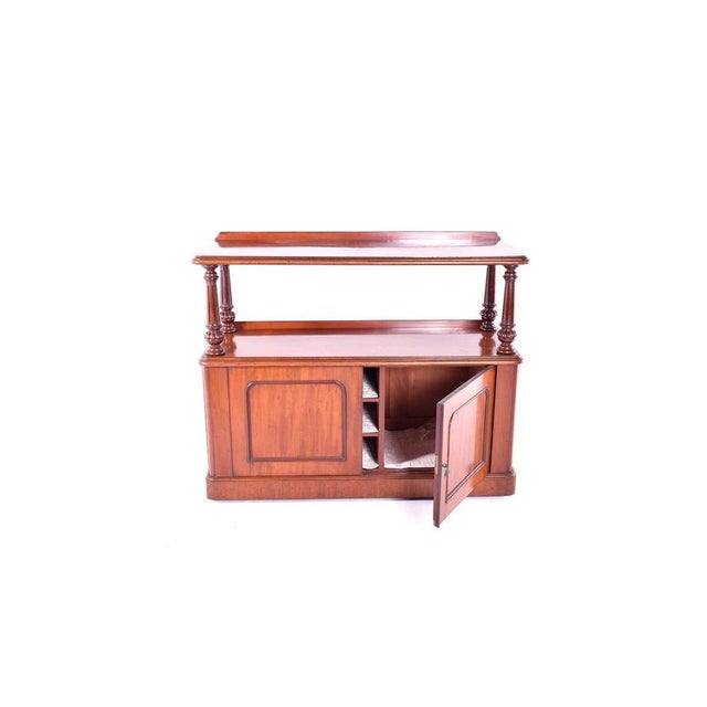 Mahogany Dumb Waiter with plenty of storage with two doors openong up to storage and two open shelved on top. On original...