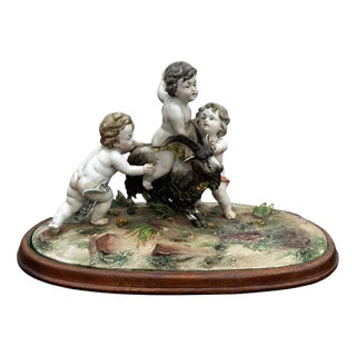 Porcelain Group of Nude Putti & the Goat Amalthea on Wooden Display Stand For Sale